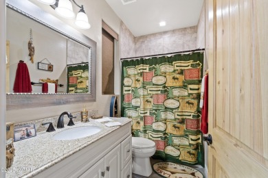 Discover timeless elegance and serene lake views in this on Pinetop Lakes Country Club in Arizona - for sale on GolfHomes.com, golf home, golf lot