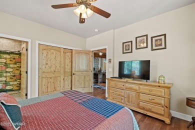Discover timeless elegance and serene lake views in this on Pinetop Lakes Country Club in Arizona - for sale on GolfHomes.com, golf home, golf lot