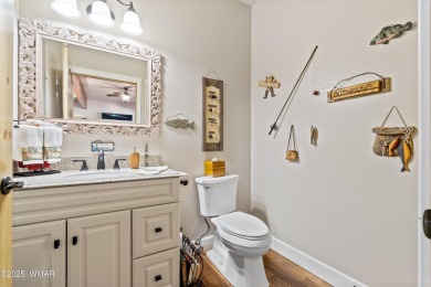 Discover timeless elegance and serene lake views in this on Pinetop Lakes Country Club in Arizona - for sale on GolfHomes.com, golf home, golf lot