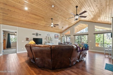 Discover timeless elegance and serene lake views in this on Pinetop Lakes Country Club in Arizona - for sale on GolfHomes.com, golf home, golf lot