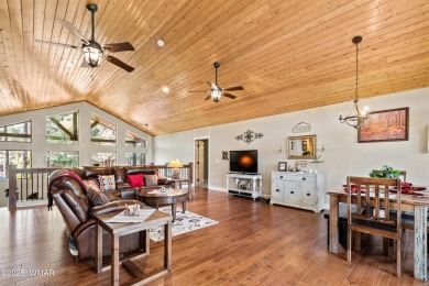 Discover timeless elegance and serene lake views in this on Pinetop Lakes Country Club in Arizona - for sale on GolfHomes.com, golf home, golf lot