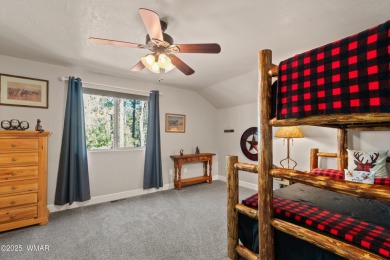 Discover timeless elegance and serene lake views in this on Pinetop Lakes Country Club in Arizona - for sale on GolfHomes.com, golf home, golf lot