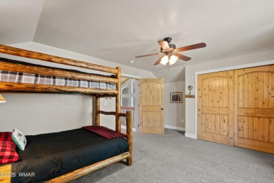 Discover timeless elegance and serene lake views in this on Pinetop Lakes Country Club in Arizona - for sale on GolfHomes.com, golf home, golf lot