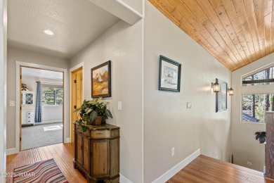 Discover timeless elegance and serene lake views in this on Pinetop Lakes Country Club in Arizona - for sale on GolfHomes.com, golf home, golf lot