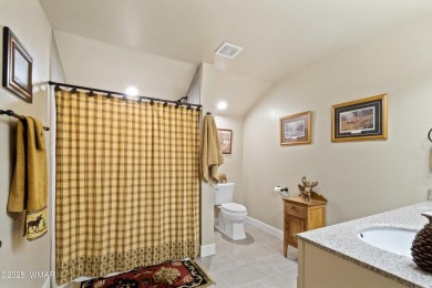Discover timeless elegance and serene lake views in this on Pinetop Lakes Country Club in Arizona - for sale on GolfHomes.com, golf home, golf lot