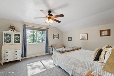 Discover timeless elegance and serene lake views in this on Pinetop Lakes Country Club in Arizona - for sale on GolfHomes.com, golf home, golf lot