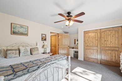 Discover timeless elegance and serene lake views in this on Pinetop Lakes Country Club in Arizona - for sale on GolfHomes.com, golf home, golf lot