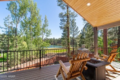 Discover timeless elegance and serene lake views in this on Pinetop Lakes Country Club in Arizona - for sale on GolfHomes.com, golf home, golf lot