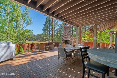 Discover timeless elegance and serene lake views in this on Pinetop Lakes Country Club in Arizona - for sale on GolfHomes.com, golf home, golf lot