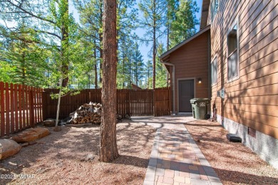 Discover timeless elegance and serene lake views in this on Pinetop Lakes Country Club in Arizona - for sale on GolfHomes.com, golf home, golf lot