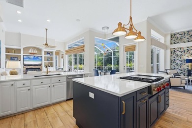 Step into a stunning, light-filled residence where elegance on University Park Country Club in Florida - for sale on GolfHomes.com, golf home, golf lot