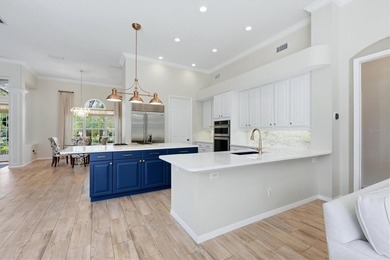 Step into a stunning, light-filled residence where elegance on University Park Country Club in Florida - for sale on GolfHomes.com, golf home, golf lot