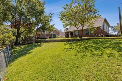 Charming two-story traditional on a deep lot, backing up to on Mesquite Municipal Golf Course in Texas - for sale on GolfHomes.com, golf home, golf lot