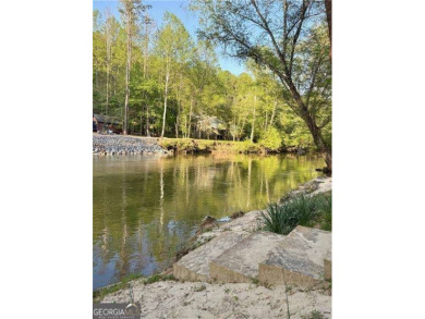 Riverfront living at itCOs finest with 110 feet of river on White Path Golf Club in Georgia - for sale on GolfHomes.com, golf home, golf lot