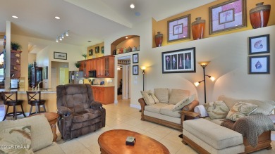 Discover the Florida lifestyle in this pool home-offered on Plantation Bay Golf and Country Club in Florida - for sale on GolfHomes.com, golf home, golf lot