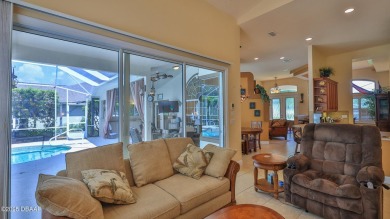 Discover the Florida lifestyle in this pool home-offered on Plantation Bay Golf and Country Club in Florida - for sale on GolfHomes.com, golf home, golf lot