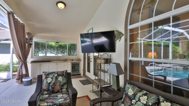 Discover the Florida lifestyle in this pool home-offered on Plantation Bay Golf and Country Club in Florida - for sale on GolfHomes.com, golf home, golf lot