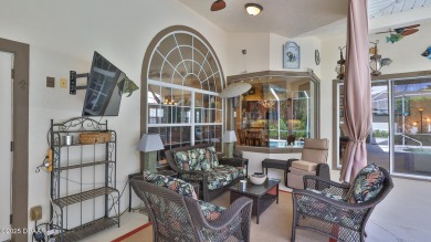 Discover the Florida lifestyle in this pool home-offered on Plantation Bay Golf and Country Club in Florida - for sale on GolfHomes.com, golf home, golf lot