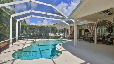 Discover the Florida lifestyle in this pool home-offered on Plantation Bay Golf and Country Club in Florida - for sale on GolfHomes.com, golf home, golf lot