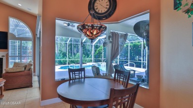 Discover the Florida lifestyle in this pool home-offered on Plantation Bay Golf and Country Club in Florida - for sale on GolfHomes.com, golf home, golf lot