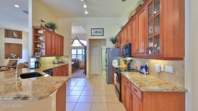 Discover the Florida lifestyle in this pool home-offered on Plantation Bay Golf and Country Club in Florida - for sale on GolfHomes.com, golf home, golf lot