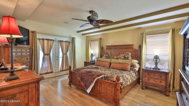 Discover the Florida lifestyle in this pool home-offered on Plantation Bay Golf and Country Club in Florida - for sale on GolfHomes.com, golf home, golf lot