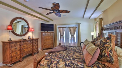 Discover the Florida lifestyle in this pool home-offered on Plantation Bay Golf and Country Club in Florida - for sale on GolfHomes.com, golf home, golf lot