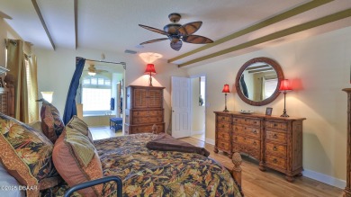 Discover the Florida lifestyle in this pool home-offered on Plantation Bay Golf and Country Club in Florida - for sale on GolfHomes.com, golf home, golf lot