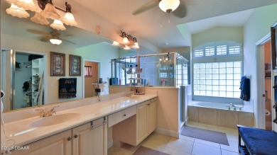 Discover the Florida lifestyle in this pool home-offered on Plantation Bay Golf and Country Club in Florida - for sale on GolfHomes.com, golf home, golf lot