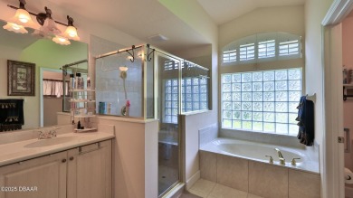 Discover the Florida lifestyle in this pool home-offered on Plantation Bay Golf and Country Club in Florida - for sale on GolfHomes.com, golf home, golf lot