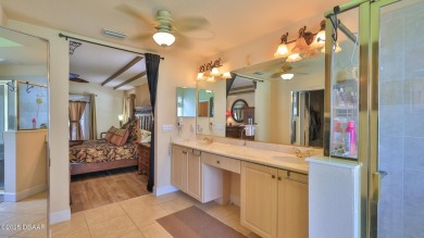 Discover the Florida lifestyle in this pool home-offered on Plantation Bay Golf and Country Club in Florida - for sale on GolfHomes.com, golf home, golf lot
