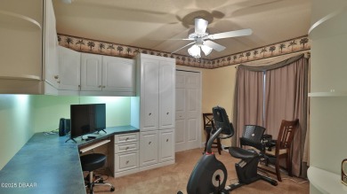 Discover the Florida lifestyle in this pool home-offered on Plantation Bay Golf and Country Club in Florida - for sale on GolfHomes.com, golf home, golf lot