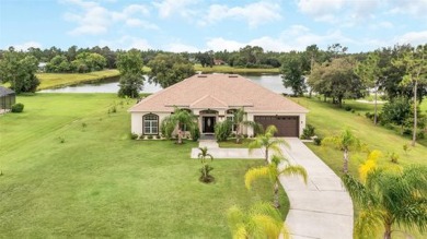 Stunning Lakefront Estate Home!!  With a 3-way split floorplan on Wedgefield Golf Club in Florida - for sale on GolfHomes.com, golf home, golf lot