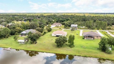 Stunning Lakefront Estate Home!!  With a 3-way split floorplan on Wedgefield Golf Club in Florida - for sale on GolfHomes.com, golf home, golf lot