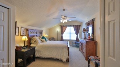 Discover the Florida lifestyle in this pool home-offered on Plantation Bay Golf and Country Club in Florida - for sale on GolfHomes.com, golf home, golf lot
