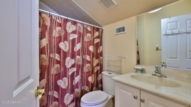 Discover the Florida lifestyle in this pool home-offered on Plantation Bay Golf and Country Club in Florida - for sale on GolfHomes.com, golf home, golf lot