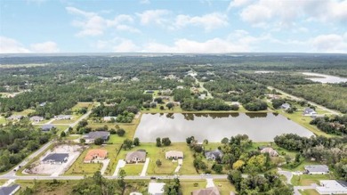 Stunning Lakefront Estate Home!!  With a 3-way split floorplan on Wedgefield Golf Club in Florida - for sale on GolfHomes.com, golf home, golf lot