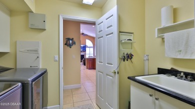 Discover the Florida lifestyle in this pool home-offered on Plantation Bay Golf and Country Club in Florida - for sale on GolfHomes.com, golf home, golf lot