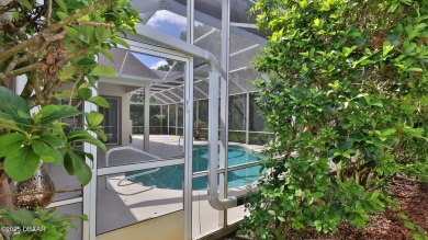 Discover the Florida lifestyle in this pool home-offered on Plantation Bay Golf and Country Club in Florida - for sale on GolfHomes.com, golf home, golf lot