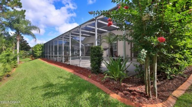 Discover the Florida lifestyle in this pool home-offered on Plantation Bay Golf and Country Club in Florida - for sale on GolfHomes.com, golf home, golf lot