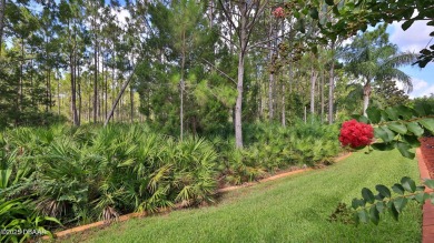 Discover the Florida lifestyle in this pool home-offered on Plantation Bay Golf and Country Club in Florida - for sale on GolfHomes.com, golf home, golf lot