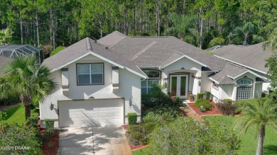 Discover the Florida lifestyle in this pool home-offered on Plantation Bay Golf and Country Club in Florida - for sale on GolfHomes.com, golf home, golf lot