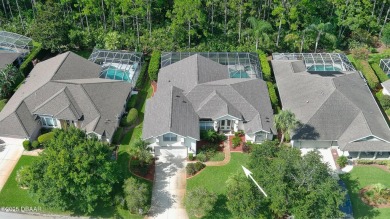 Discover the Florida lifestyle in this pool home-offered on Plantation Bay Golf and Country Club in Florida - for sale on GolfHomes.com, golf home, golf lot