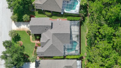 Discover the Florida lifestyle in this pool home-offered on Plantation Bay Golf and Country Club in Florida - for sale on GolfHomes.com, golf home, golf lot