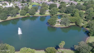 Discover the Florida lifestyle in this pool home-offered on Plantation Bay Golf and Country Club in Florida - for sale on GolfHomes.com, golf home, golf lot