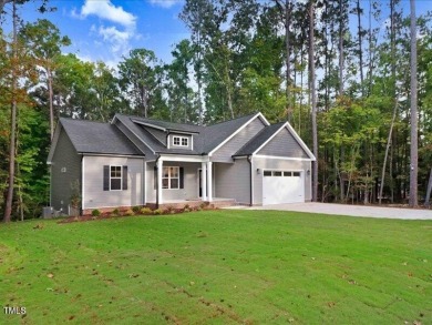 Beautiful custom built home in the highly sought after gated on River Golf and County Club at Lake Royale in North Carolina - for sale on GolfHomes.com, golf home, golf lot