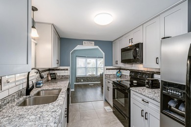 Immaculate and exquisitely updated 2-bedroom, 2-bathroom retreat on Barefoot Bay Golf Course in Florida - for sale on GolfHomes.com, golf home, golf lot