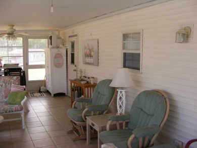 Furnished Park Model on large corner lot with shed and spacious on Deer Creek RV Golf Resort in Florida - for sale on GolfHomes.com, golf home, golf lot