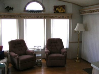 Furnished Park Model on large corner lot with shed and spacious on Deer Creek RV Golf Resort in Florida - for sale on GolfHomes.com, golf home, golf lot