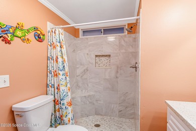 Immaculate and exquisitely updated 2-bedroom, 2-bathroom retreat on Barefoot Bay Golf Course in Florida - for sale on GolfHomes.com, golf home, golf lot